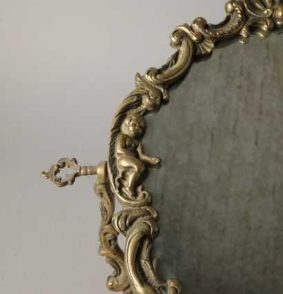 Psyché or table mirror in bronze with cherubs,...