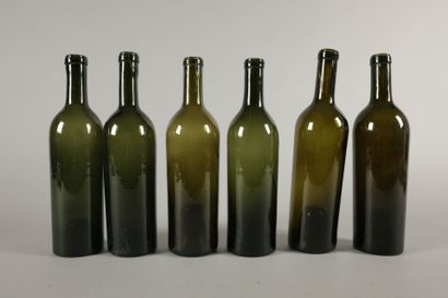 Six Bordeaux-shaped bottles in dark green...