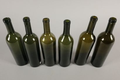 Six Bordeaux-shaped bottles in dark green...