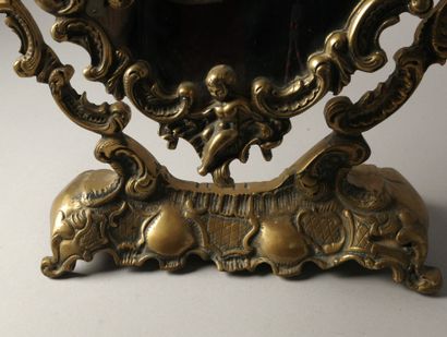 Psyché or table mirror in bronze with cherubs,...