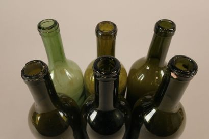 Six Bordeaux-shaped bottles in glass of various...