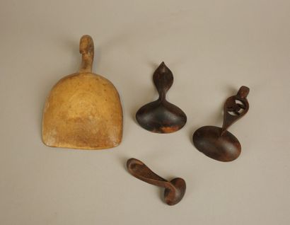 Set of four wooden cream scoops including:...