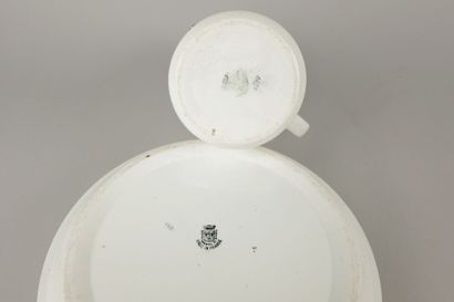 SAINT AMAND. Earthenware jug and basin decorated...