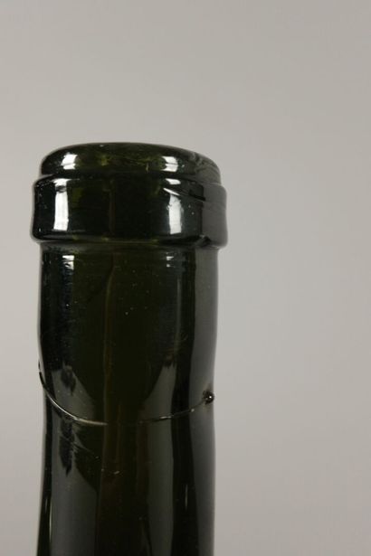 Six Bordeaux-shaped bottles in dark green...