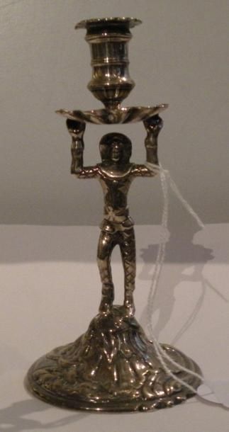 Bougeoir en argent, le fut à décor d'un arlequin,...