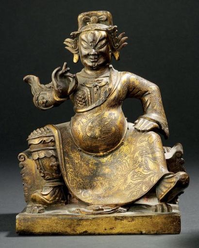 Statuette de roi gardien en bronze partiellement...