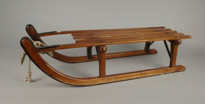 Vintage wooden sled with metal runners
95...