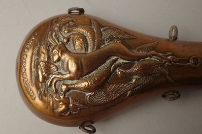 Set of two copper powder flasks: one with...