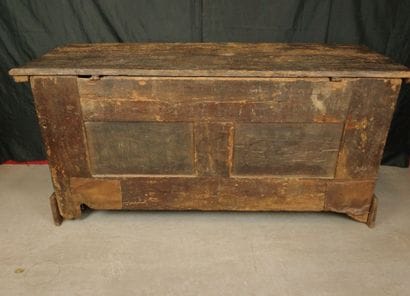 Large natural wood chest with a paneled front...