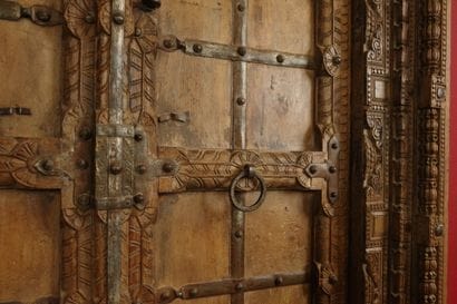 Frame with two natural wood doors richly...