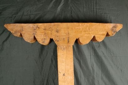 Carved pine column with a console decorated...