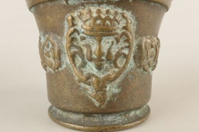 Bronze mortar decorated with a crowned head,...