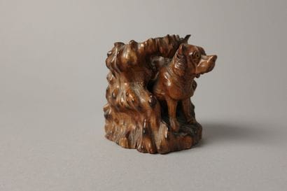 A finely carved boxwood match holder featuring...