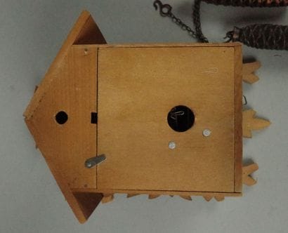 Black Forest-style wooden cuckoo clock with...