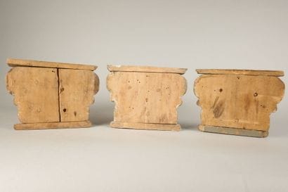 Three sections of Corinthian capitals made...
