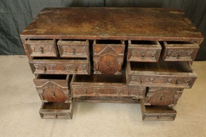 Natural oak cabinet with an ornate front,...