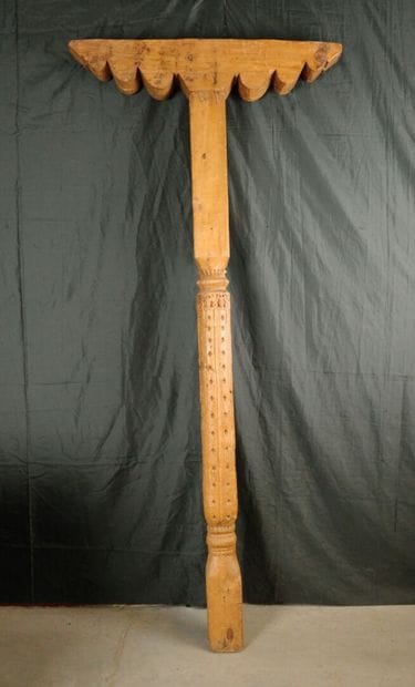 Carved pine column with a console decorated...