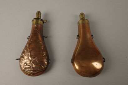 Set of two copper powder flasks: one with...