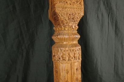Carved pine column with a console decorated...