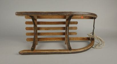 Vintage wooden sled with metal runners
70...