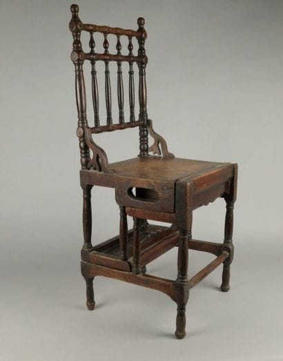 A four-step stool-style chair made of dark...