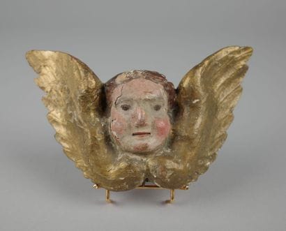 Baroque winged putto head, carved from polychrome...