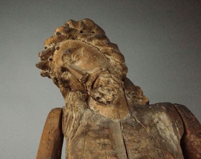 Carved wooden Christ in bonds with traces...