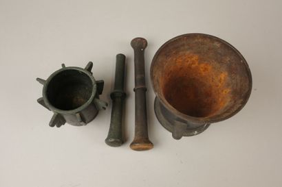 Two mortars and their pestles, one cast iron...