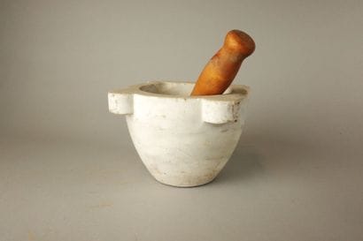 White marble mortar with 4 wings and a wooden...