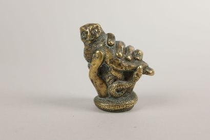 Bronze knob depicting a hand clutching an...