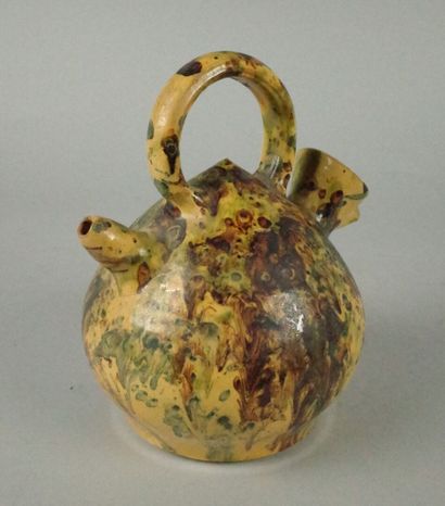 Glazed terracotta jug with a marbled design...