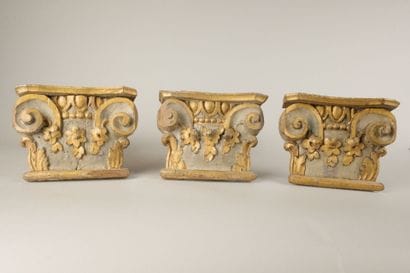 Three sections of Corinthian capitals made...