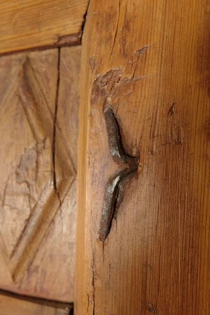 Antique paneled door carved with diamond-shaped...