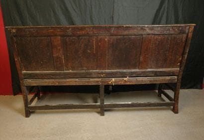 6-foot natural wood bench with a molded paneled...