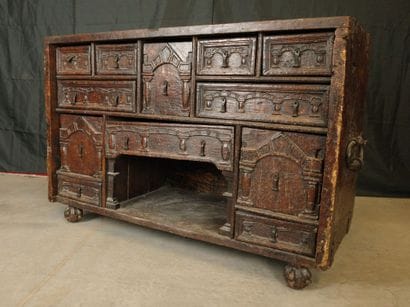 Natural oak cabinet with an ornate front,...