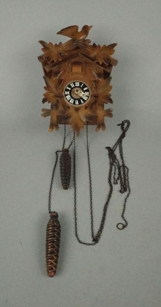 Black Forest-style wooden cuckoo clock with...