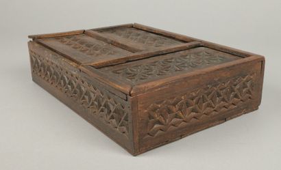 Set includes: - A carved wooden box with...