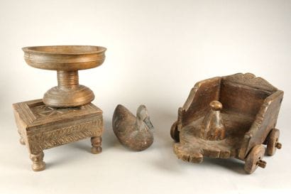 A small coffee table made of wood carved...