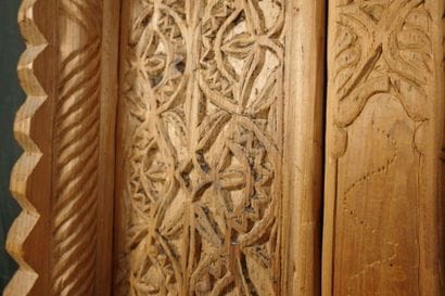 Antique wooden facade richly carved with...