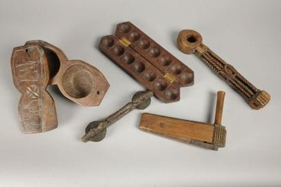 Set including a wooden rattle, a two-compartment...