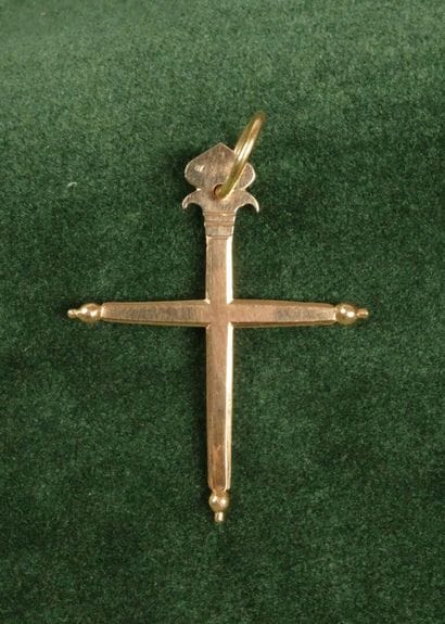 A flat cross made of 750 gold, topped with...