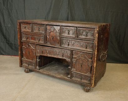 Natural oak cabinet with an ornate front,...