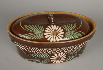 Brown glazed terracotta baeckeoffe dish decorated...