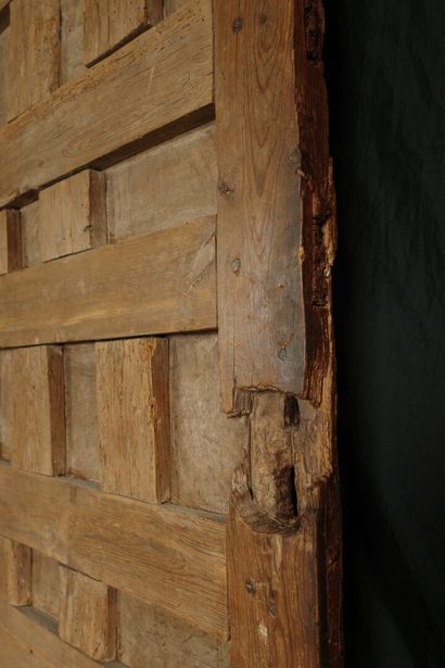 Antique paneled door carved with diamond-shaped...