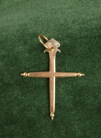 A flat cross made of 750 gold, topped with...