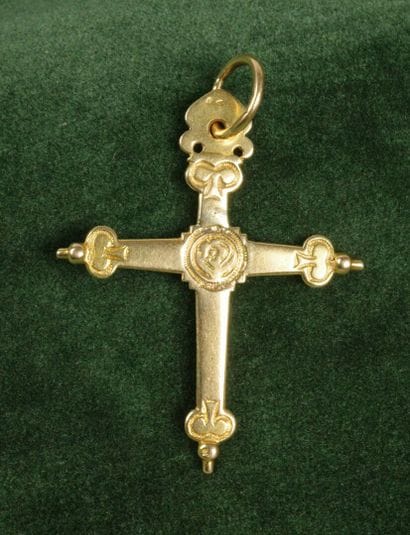 750 gold Croix Jeannette with a chased design...