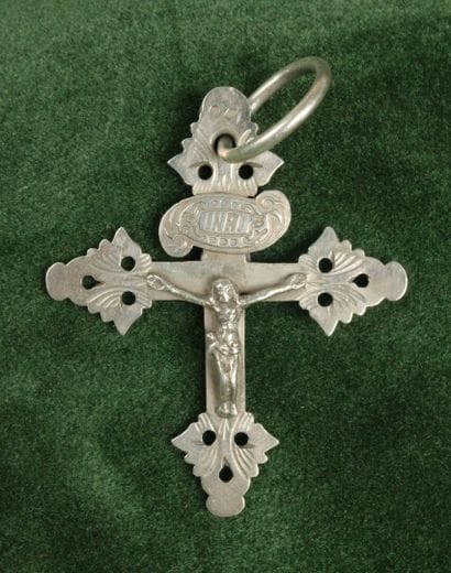 Large silver lattice cross depicting Christ...