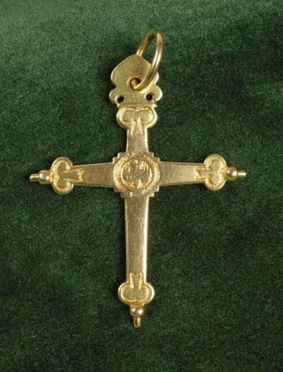 750 gold Croix Jeannette with a chased design...