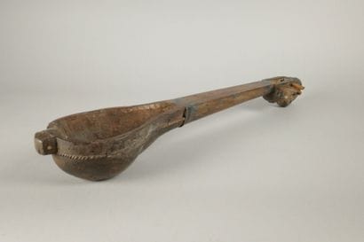 Set including a wooden rattle, a two-compartment...