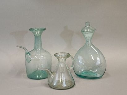 A shepherd's bottle in slightly bluish glass...